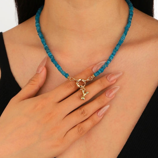 Neon Blue Apatite Initial Necklace worn by model