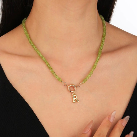 Peridot Initial Necklace worn by model